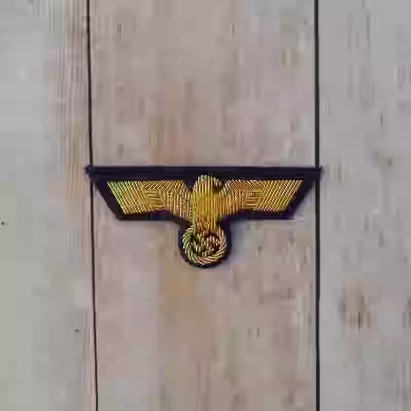 Kriegsmarine Officer's Hand Embroidered Cap Eagle Kriegsmarine Officer's Hand Embroidered Cap Eagle – Premium Replica, made of Gold wire on darkblue wool background