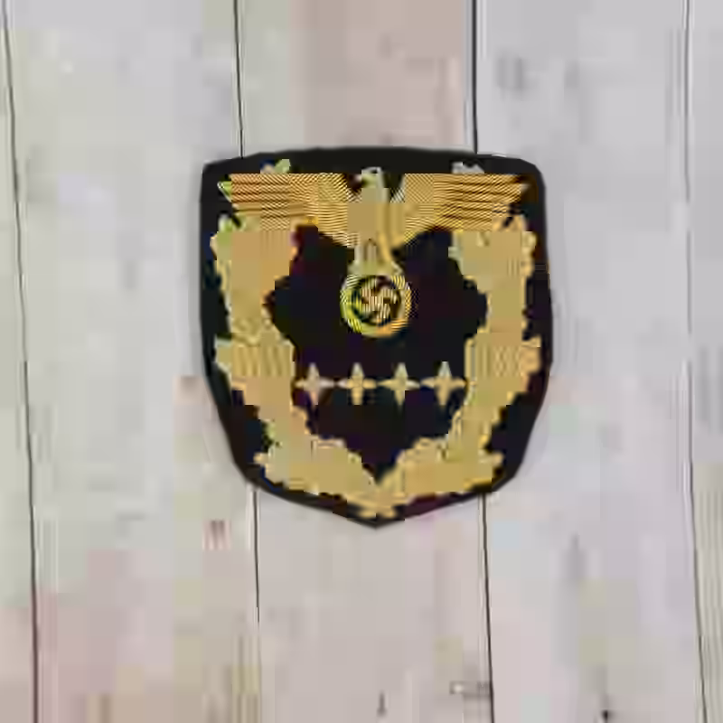 Reichsminister 1940-1942 Sleeve Rank Insignia Reichsminister 1940-1942 Sleeve Rank Insignia – Premium Replica, made of Gold thread embroidery on black background