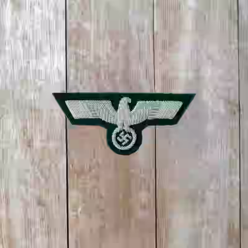 Wehrmacht Army Officer's Hand Embroidered Silver Breast Eagle Wehrmacht Army Officer's Hand Embroidered Silver Breast Eagle – Premium Replica, made of Silver thread embroidery on dark green background