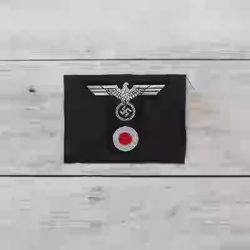 Panzer M42 Silk Woven Officer's Cap Insignia Panzer M42 Silk Woven Officer's Cap Insignia – Premium Replica, made of Silver thread eagle on dark grey wool background