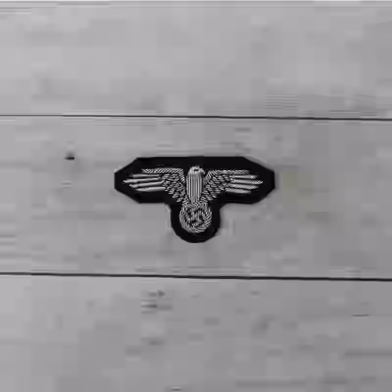 Waffen SS Officer's Hand Embroidered Cap Eagle Waffen SS Officer's Hand Embroidered Cap Eagle – Premium Replica, made of Hand-embroidered silver thread eagle on black wool background