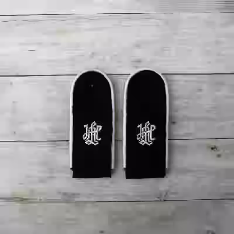 Leibstandarte SS Enlisted Men's Shoulder Boards Leibstandarte SS Enlisted Men's Shoulder Boards – Premium Replica, made of Black wool with white cotton piping