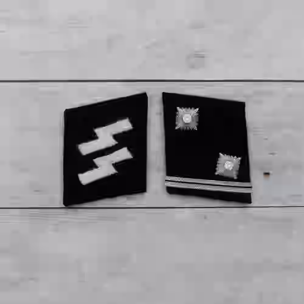 SS Hauptscharführer Collar Tabs SS Hauptscharführer Collar Tabs – Premium Replica, made of Two metallic silver stars and one line of aluminum litzen on black wool background