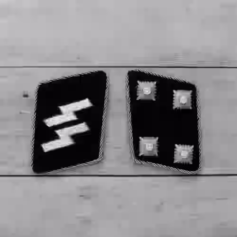 SS Sturmbannführer Collar Tabs SS Sturmbannführer Collar Tabs – Premium Replica, made of Four metallic silver stars and silver piping on black wool background