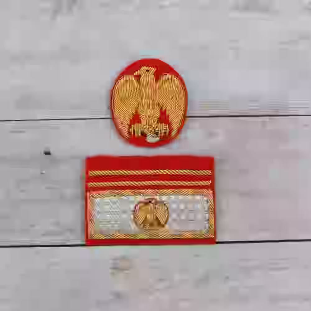 Italian MVSN General Cap Eagle and Sleeve Badge Italian MVSN General Cap Eagle and Sleeve Badge – Premium Replica, made of Hand-embroidered gold aluminum thread on red wool background