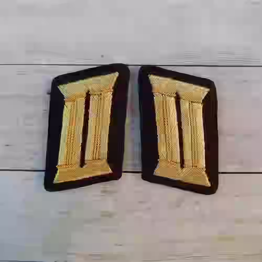 NSDAP Kreisleiter District Leader Collar Tabs NSDAP Kreisleiter District Leader Collar Tabs – Premium Replica, made of Hand-embroidered gold thread on dark maroon wool background