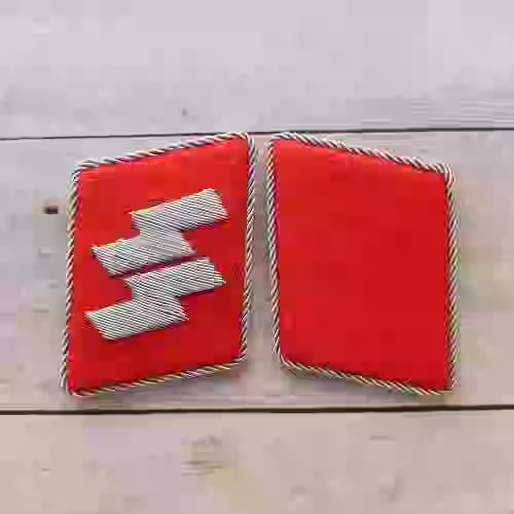 Waffen-SS 29th Division Italian Officer Collar Tabs Waffen-SS 29th Division Italian Officer Collar Tabs – Premium Replica, made of Hand-embroidered silver thread on red wool background