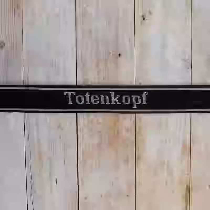 Totenkopf EM Cuff Title Totenkopf EM Cuff Title – Premium Replica, made of Black woven silk with hand-embroidered grey thread (Be-Vo style)