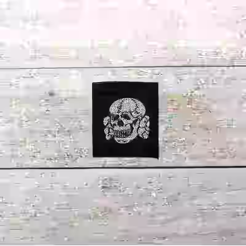 Waffen-SS Officer's Cap Skull Waffen-SS Officer's Cap Skull – Premium Replica, made of Silver aluminum thread on black silk background