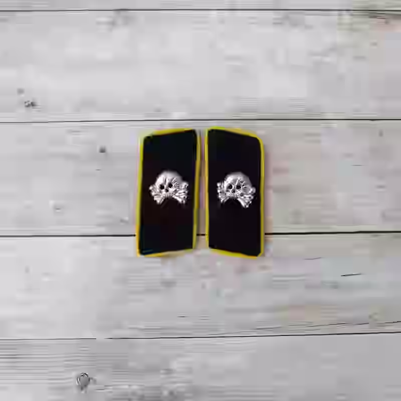 Panzer Communication and Signals Enlisted Men's Collar Tabs Panzer Communication and Signals Enlisted Men's Collar Tabs – Premium Replica, made of Black wool with metal skulls and yellow piping