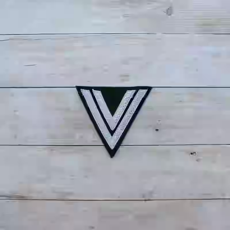 Wehrmacht Obergefreiter M36 Uniform Sleeve Chevron Wehrmacht Obergefreiter M36 Uniform Sleeve Chevron – Premium Replica, made of Aluminum litzens on darkgreen cotton background